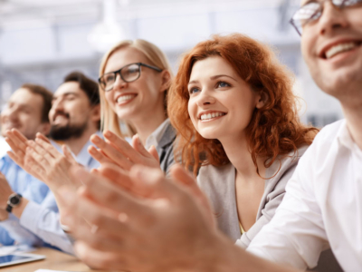 Happy,Business,Team,Applauding,At,Conference